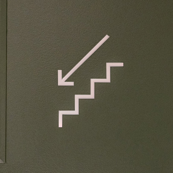 Pictogramme Escalier descendant blanc, vue rapprochée